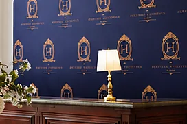 Detail of the gold-crested navy reception backdrop